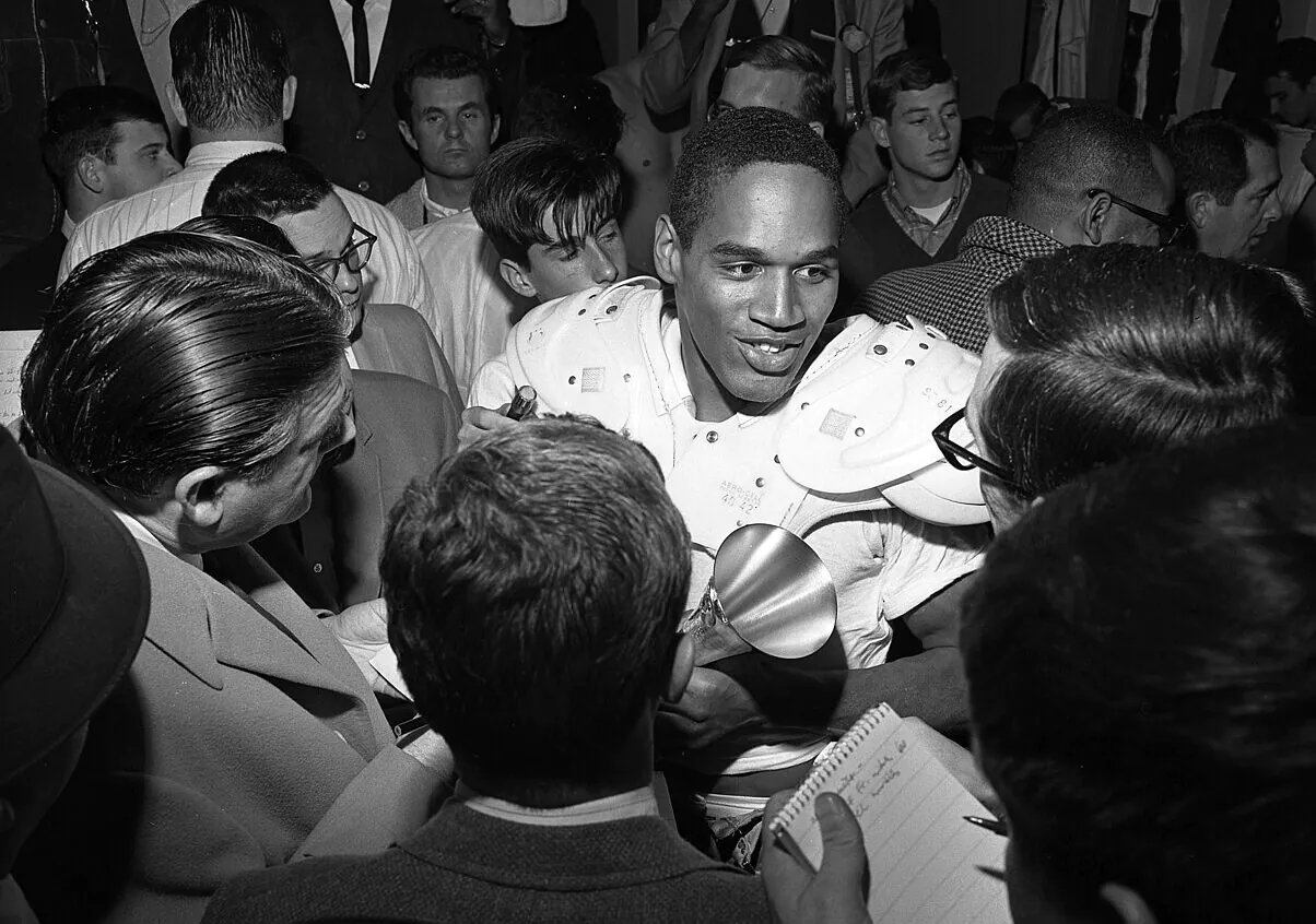 O.J._Simpson_talking_to_reporters,_1967