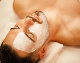 Relaxed man having facial treatment at the spa.