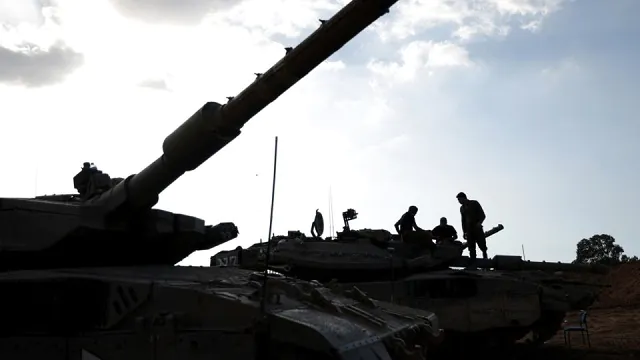 Israeli soldiers gathered along the Gaza border